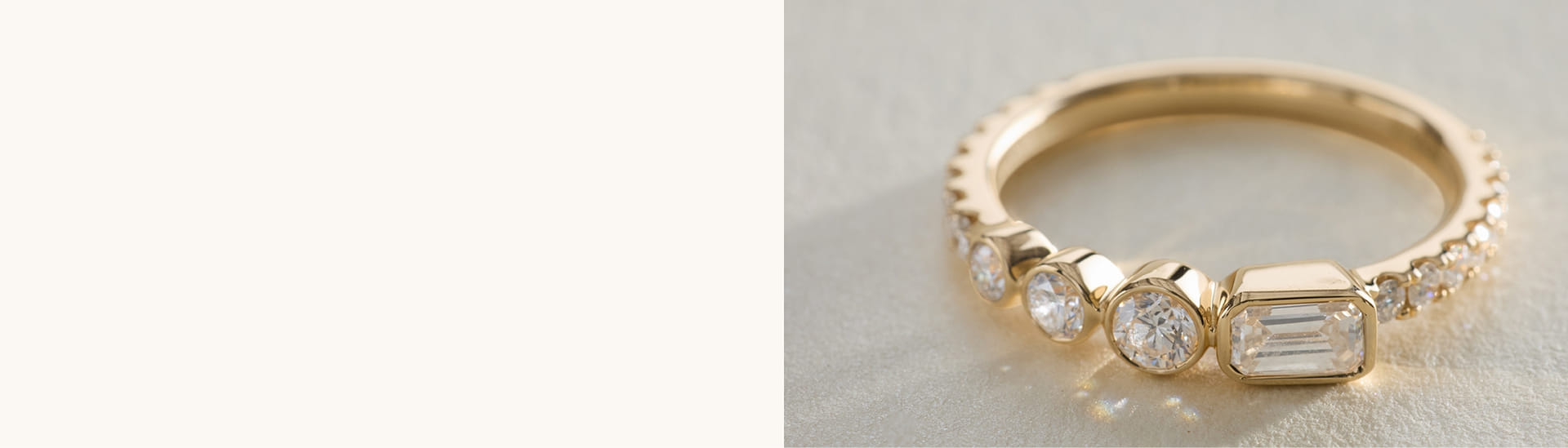 Yellow gold bezel-set diamond ring with mixed shapes.